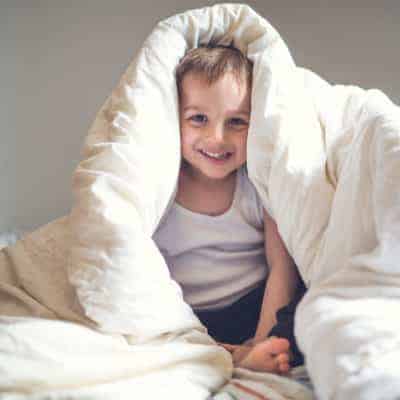 9 tried-and-true strategies to make bedtime easier with kids. Bedtime for kids doesn't have to be stressful. Help your kids go to bed without a battle. 9 Ways to Make bedtime easier.
