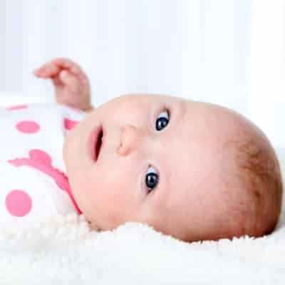 Signs Your Baby is Ready to Drop a Nap. How to tell and what to do when baby is dropping a nap. Handling nap transitions and adjusting your daily routine for one less nap a day. Do you drop the afternoon nap or the morning nap first? Learn when common nap transitions occur, and how to handle these nap challenges.
