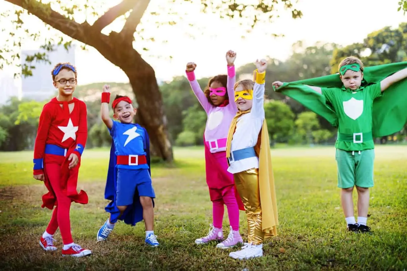 Kids dressed in superhero costumes — wearable party favor ideas instead of goody bags.