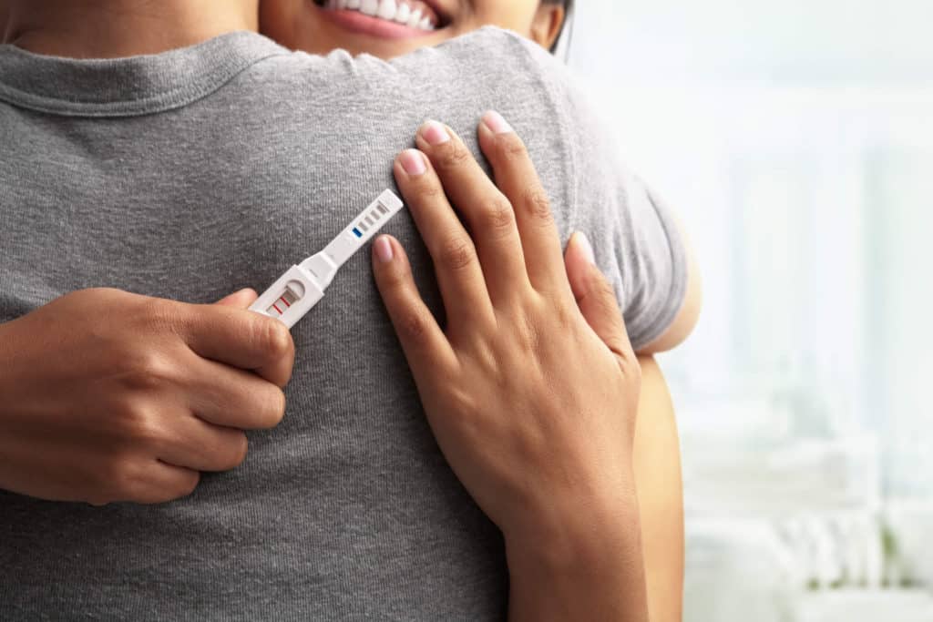 Woman Holding a Pregnancy Test